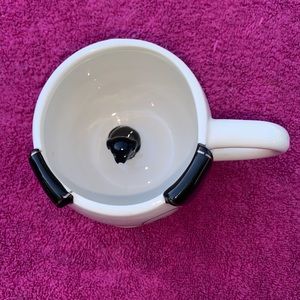 This is a cute world market dog mug but  there is a surprise inside.